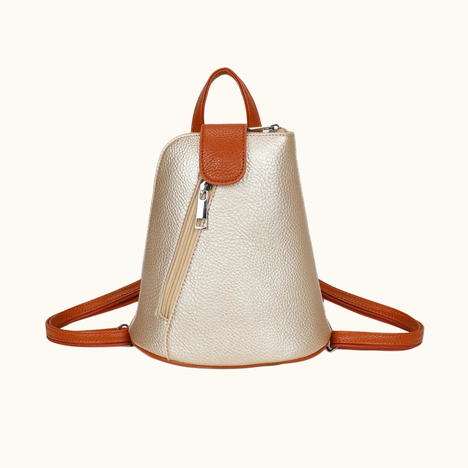 Gold metallic backpack with brown leather straps and handle on a white background