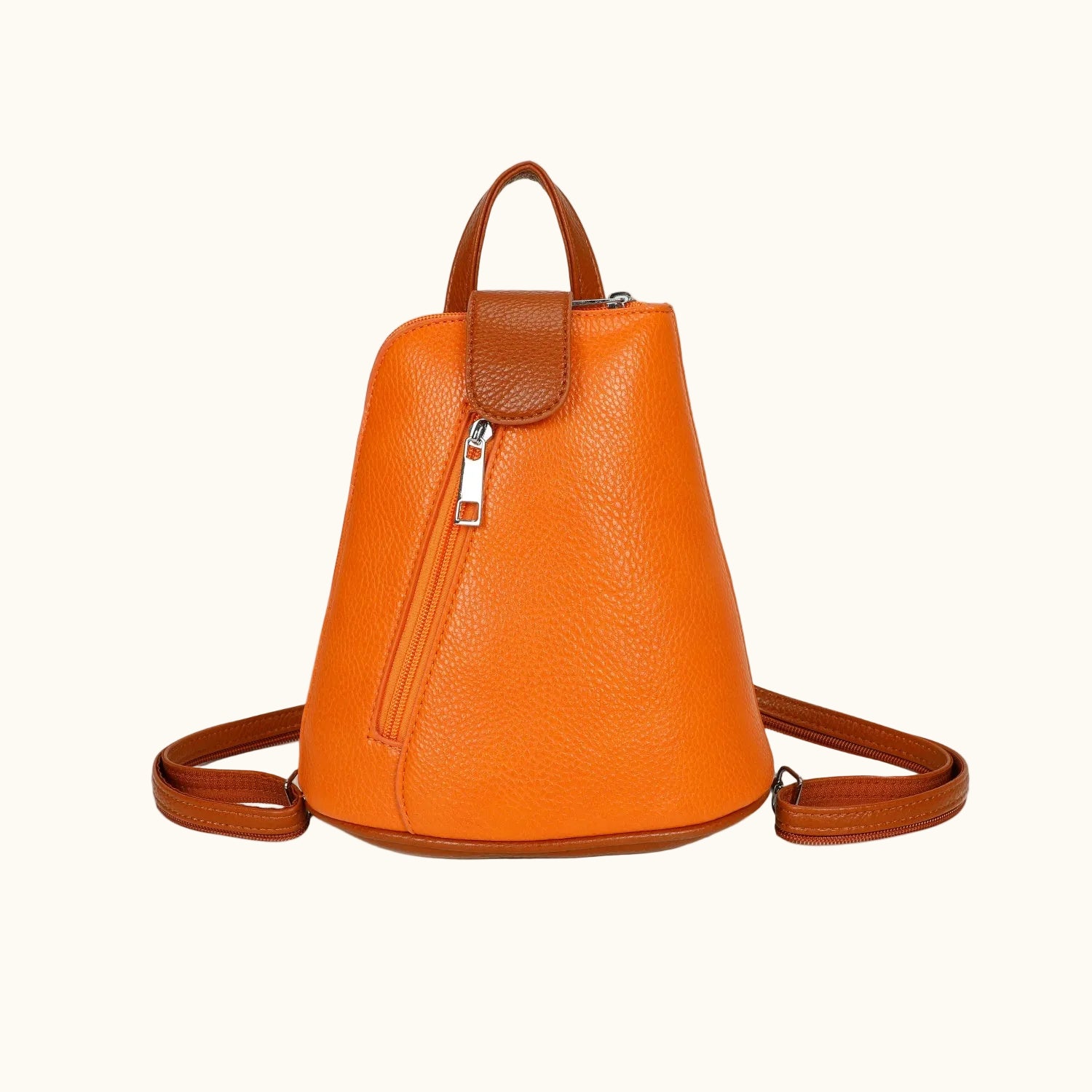 Orange leather backpack with a strap on a white background