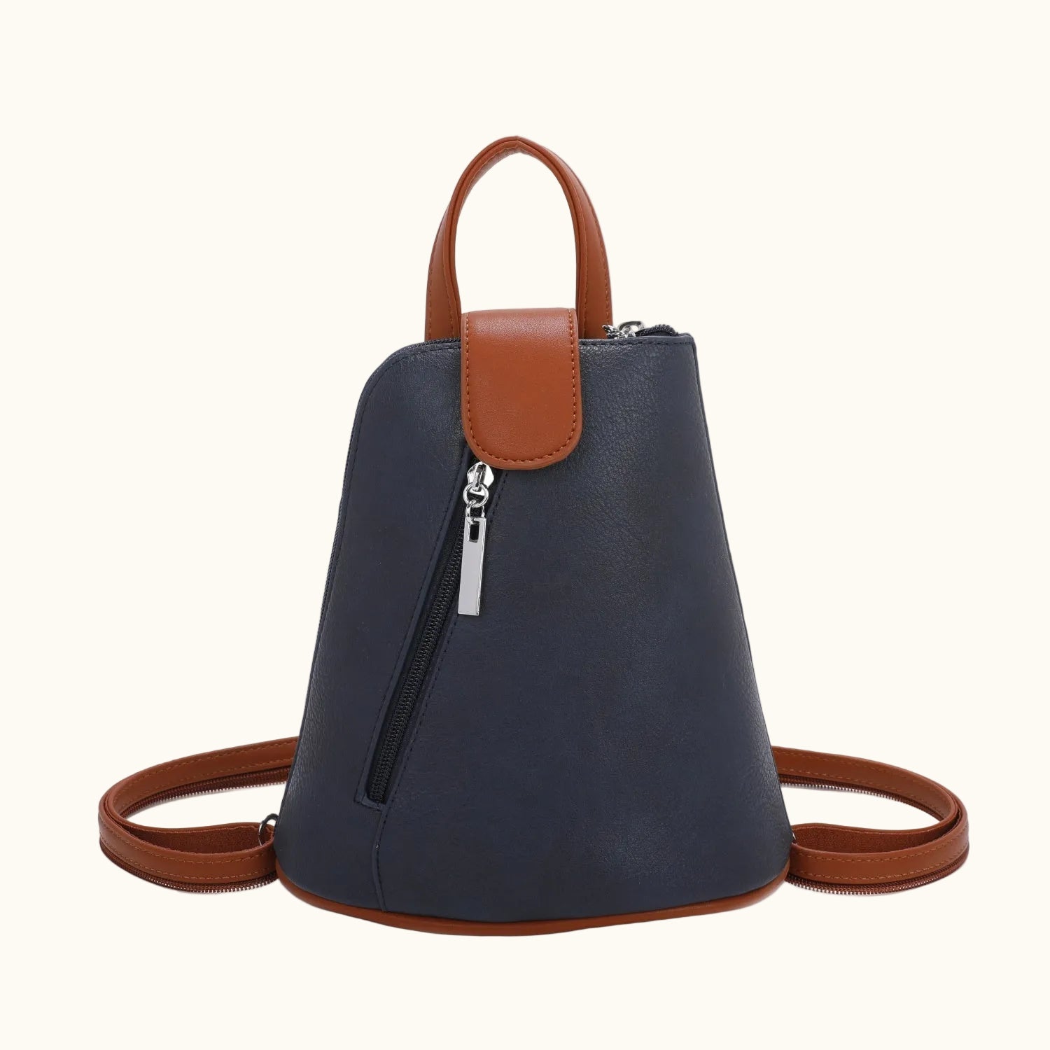 Blue backpack with brown leather straps on a white background