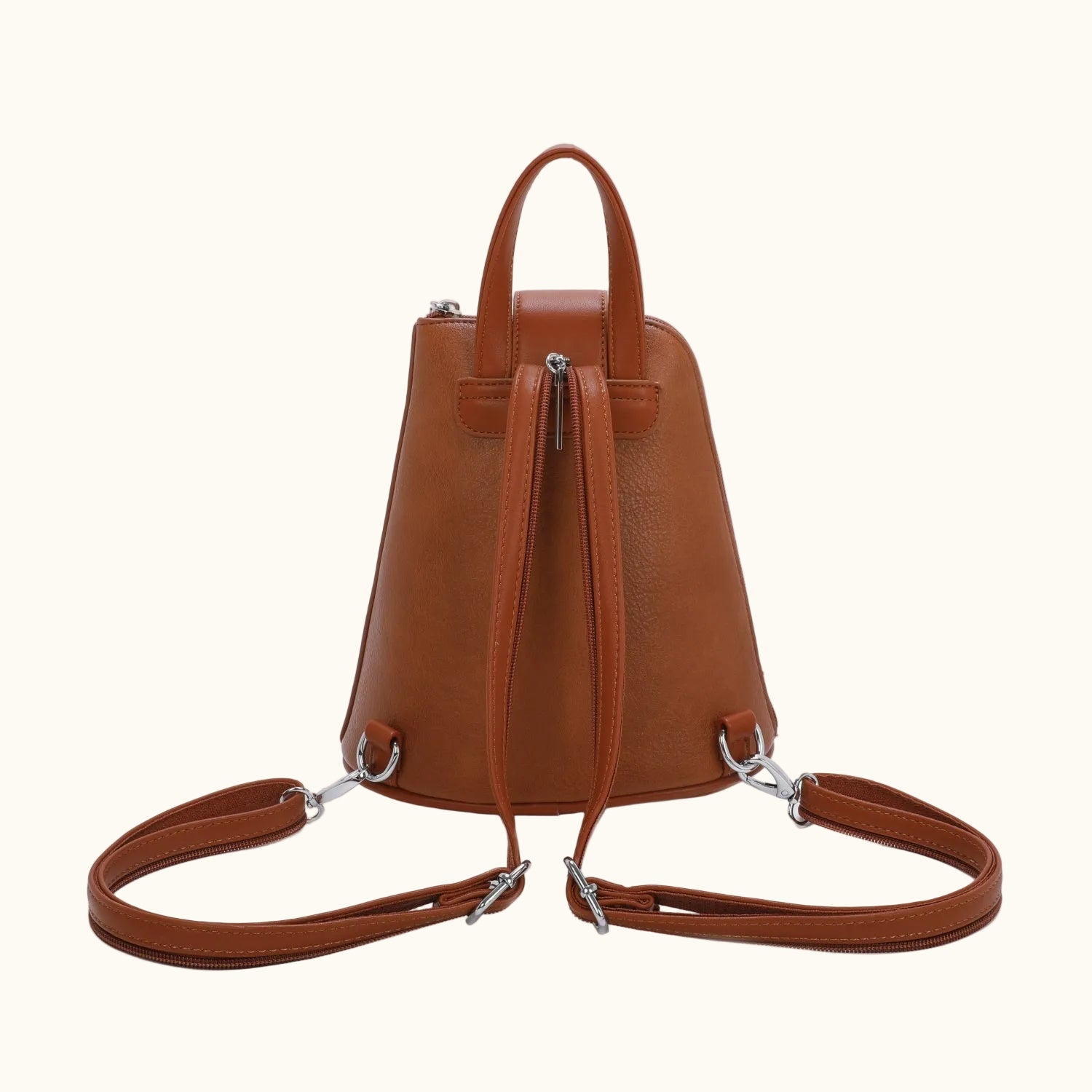 Brown leather backpack with a shoulder strap on a white background