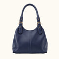 Navy blue handbag with gold hardware on a white background