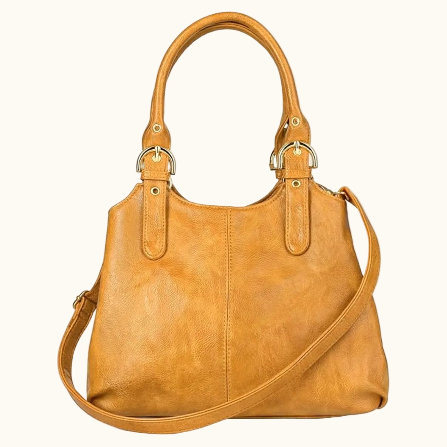 Brown leather handbag with a shoulder strap on a white background