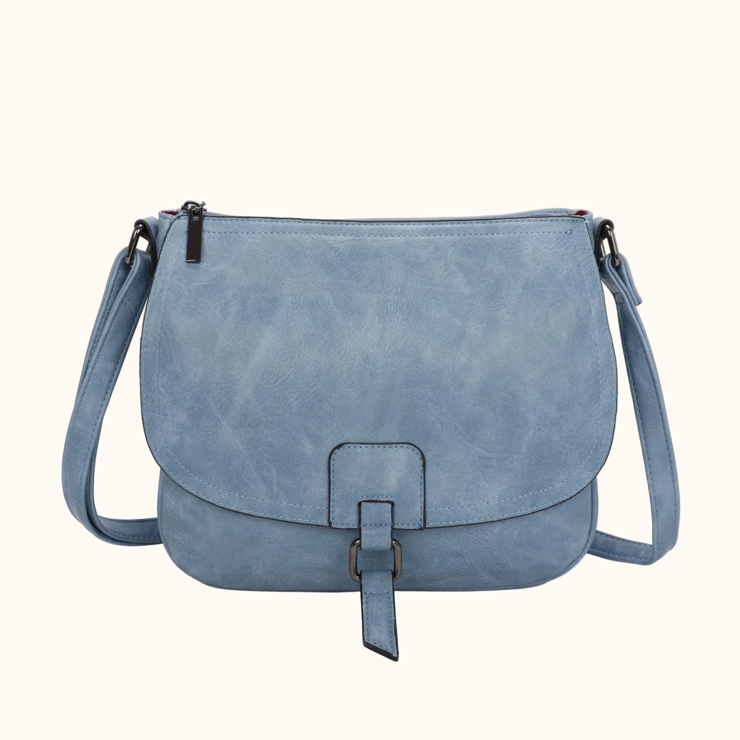 Blue leather handbag with a strap on a white background