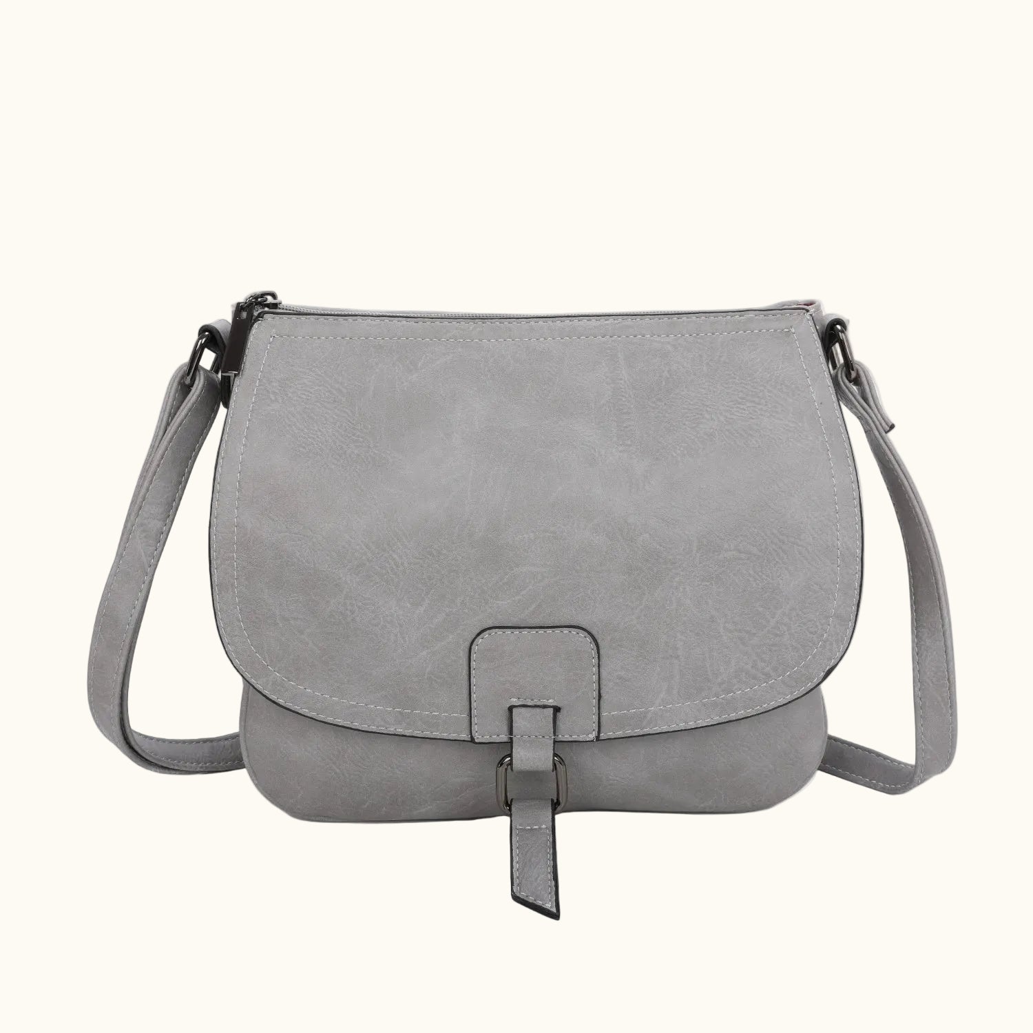 Gray leather handbag with a strap on a white background