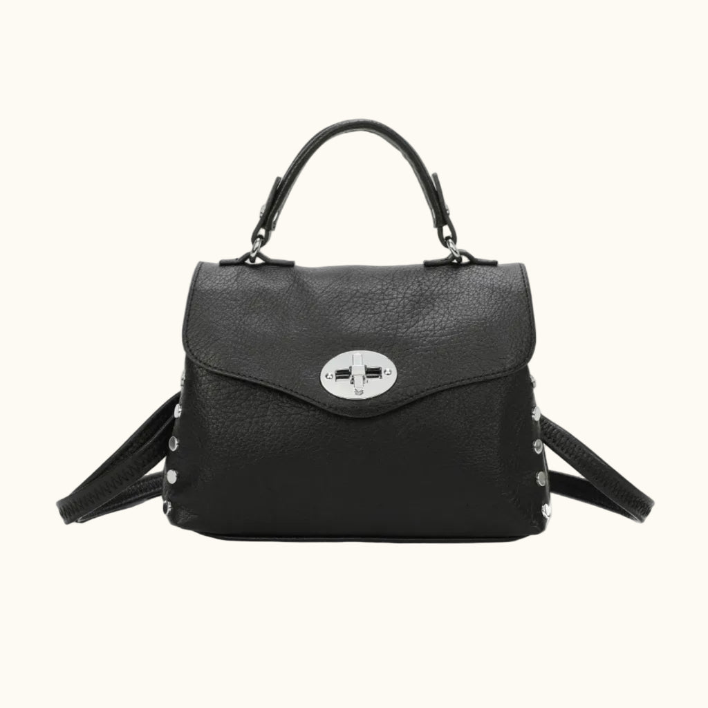 Black handbag with a silver clasp on a white background
