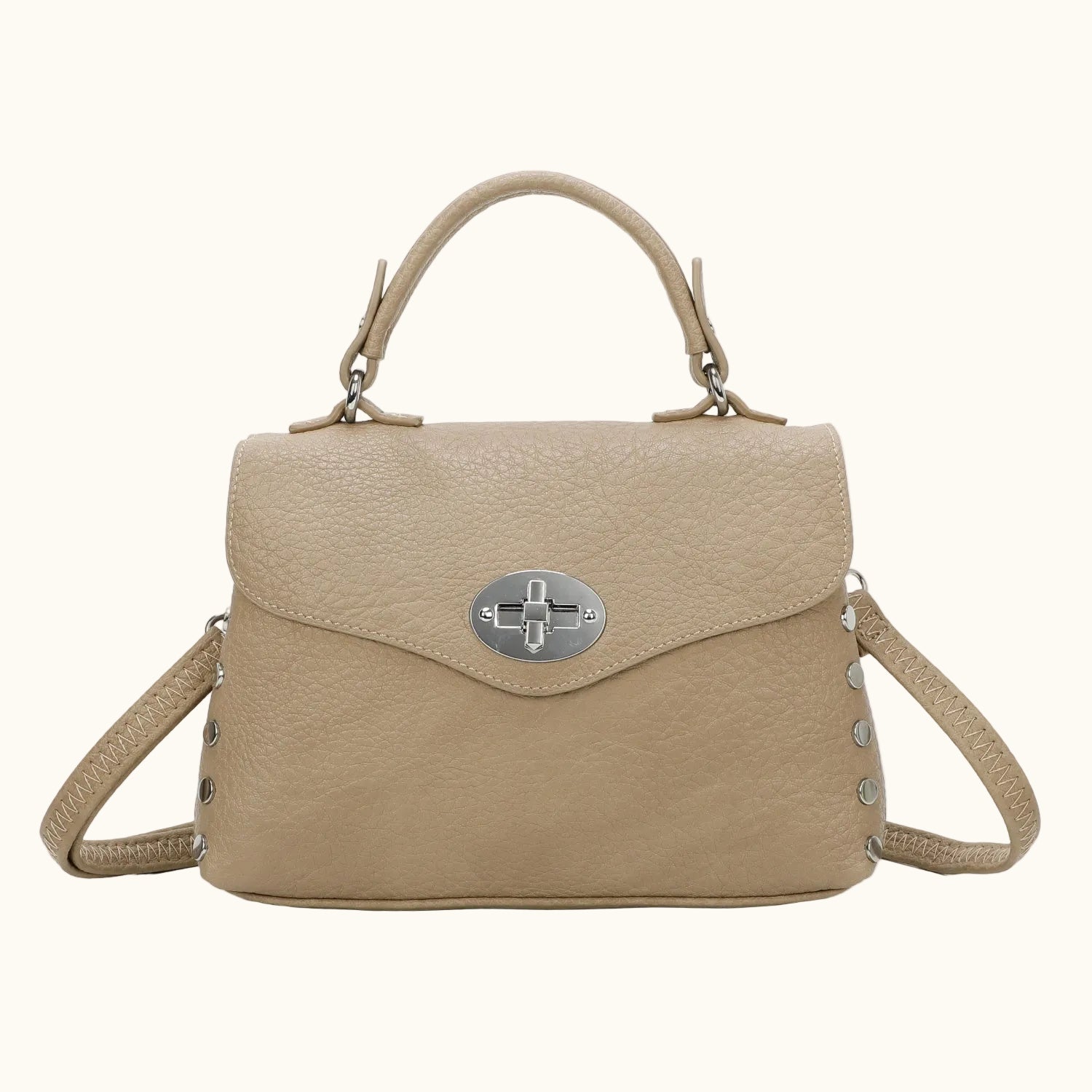 Beige handbag with a silver clasp on a white background