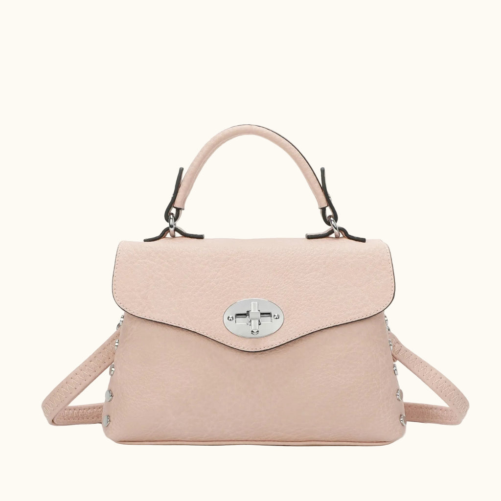 Pink handbag with a silver clasp on a white background