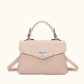 Pink handbag with a silver clasp on a white background