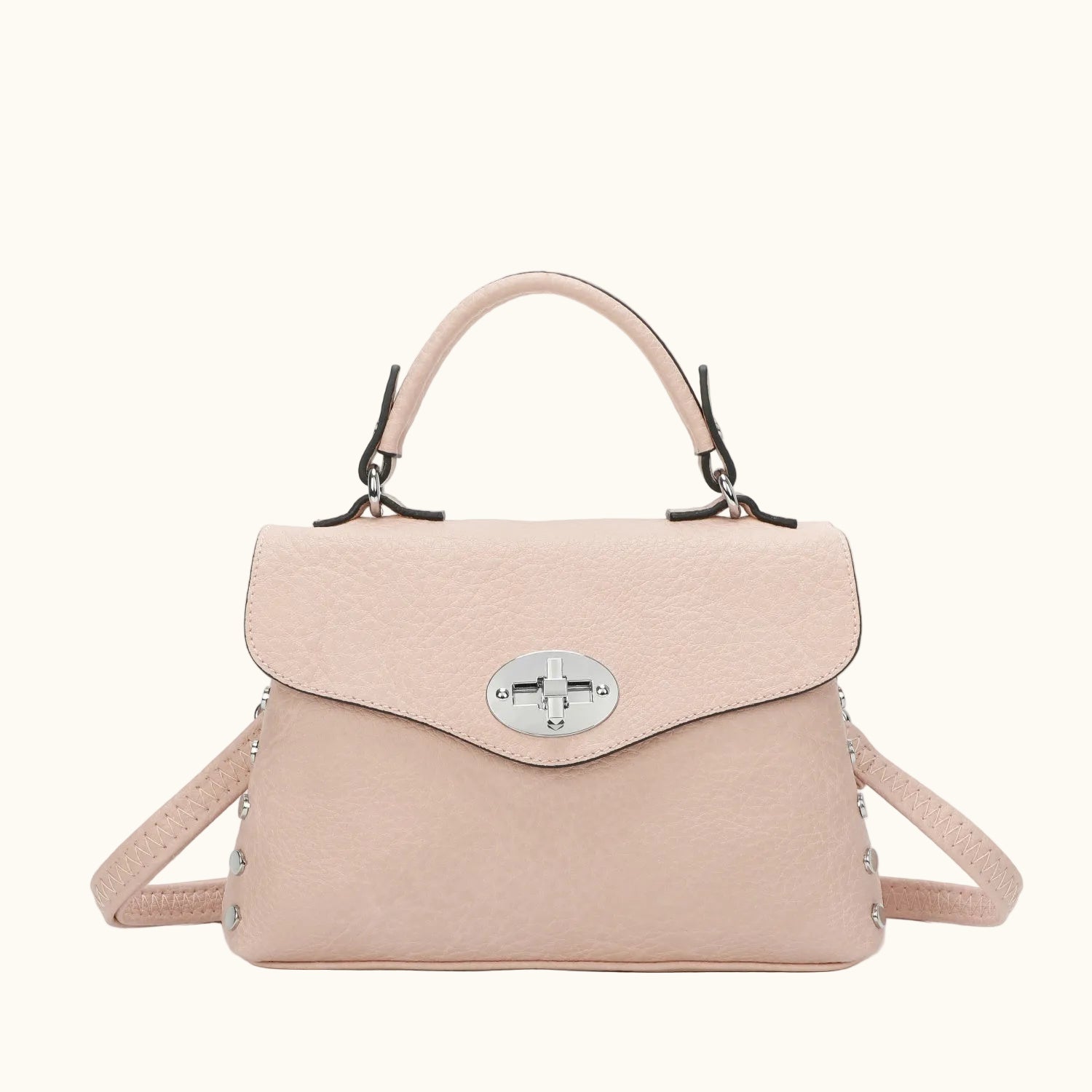 Pink handbag with a silver clasp on a white background