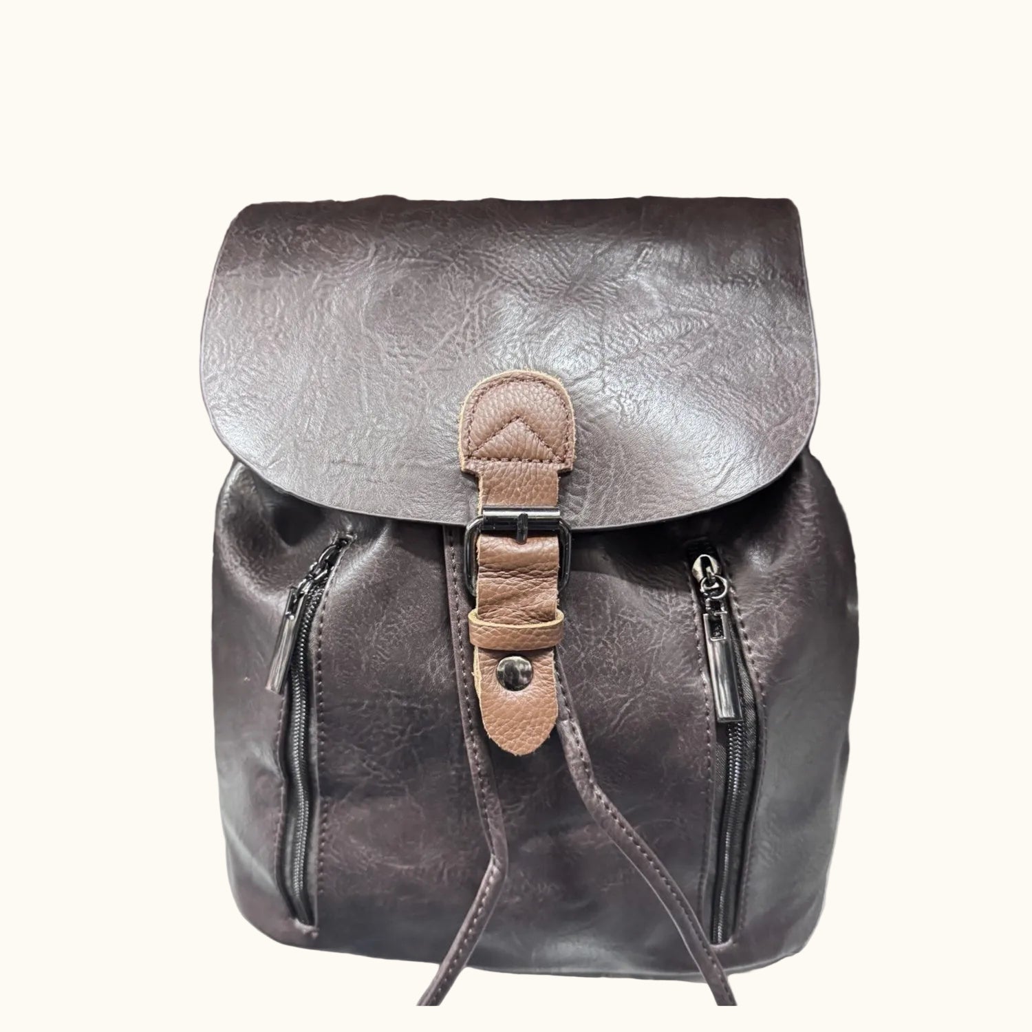 Brown leather backpack with a strap on a white surface