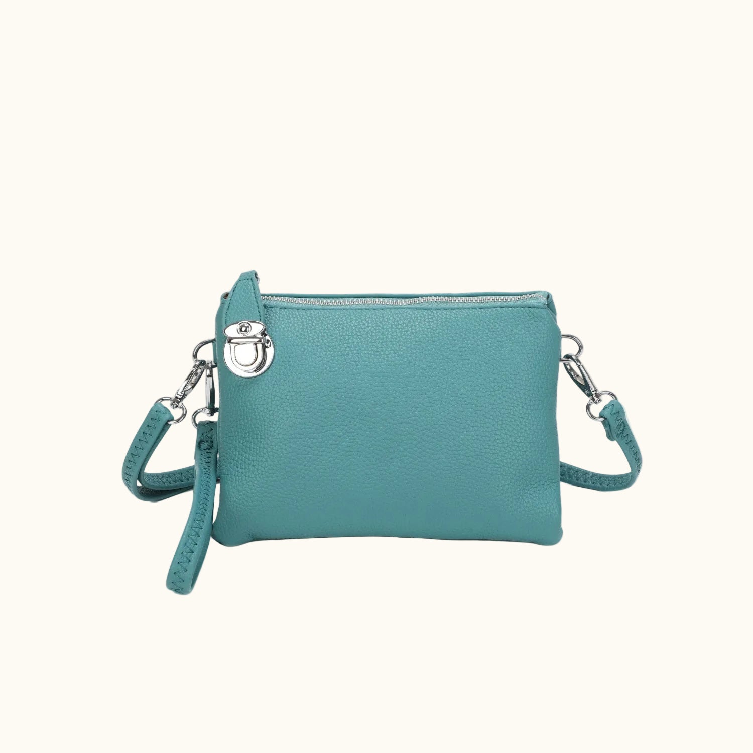 Teal handbag with a strap on a white background