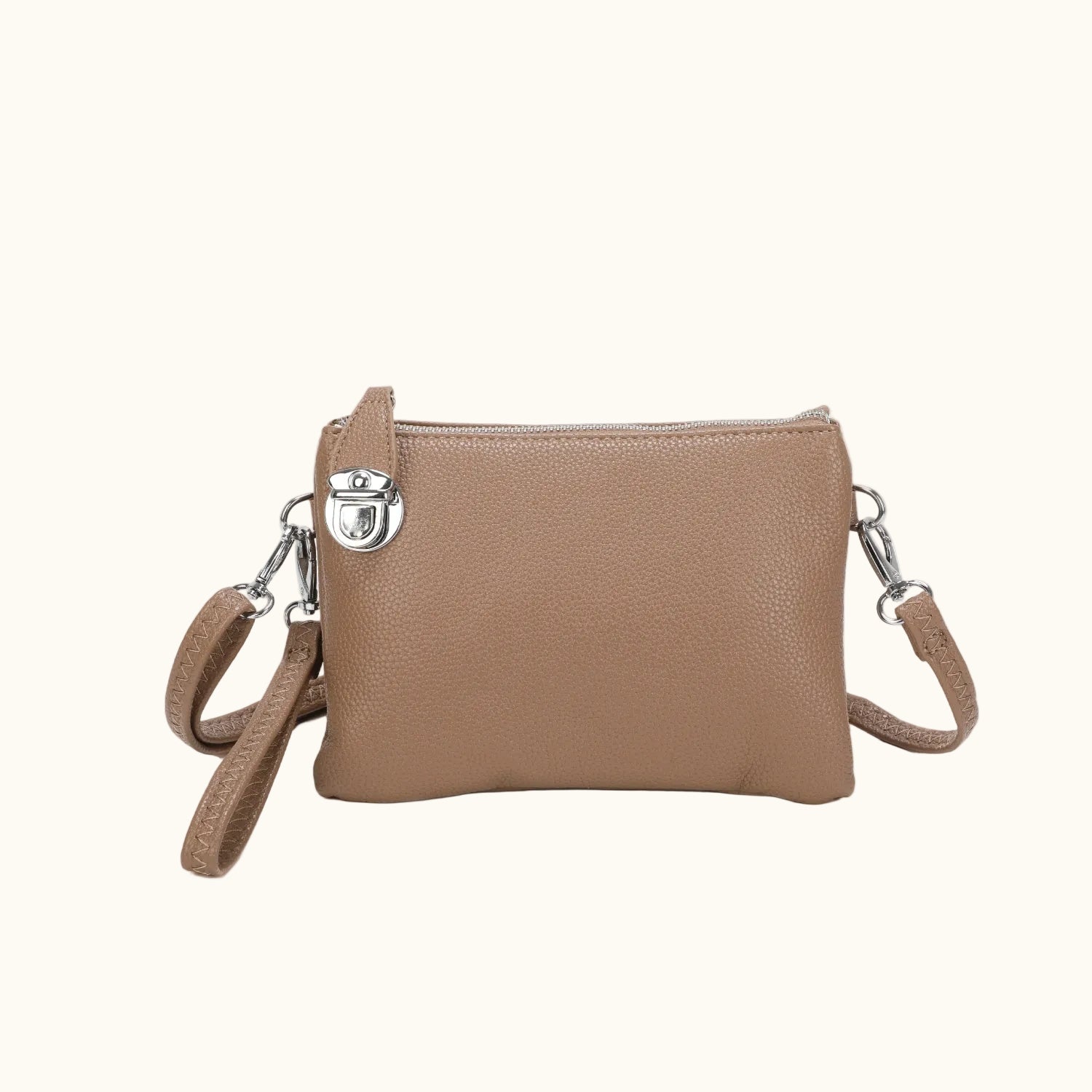 Brown leather crossbody bag with silver clasp on a white background