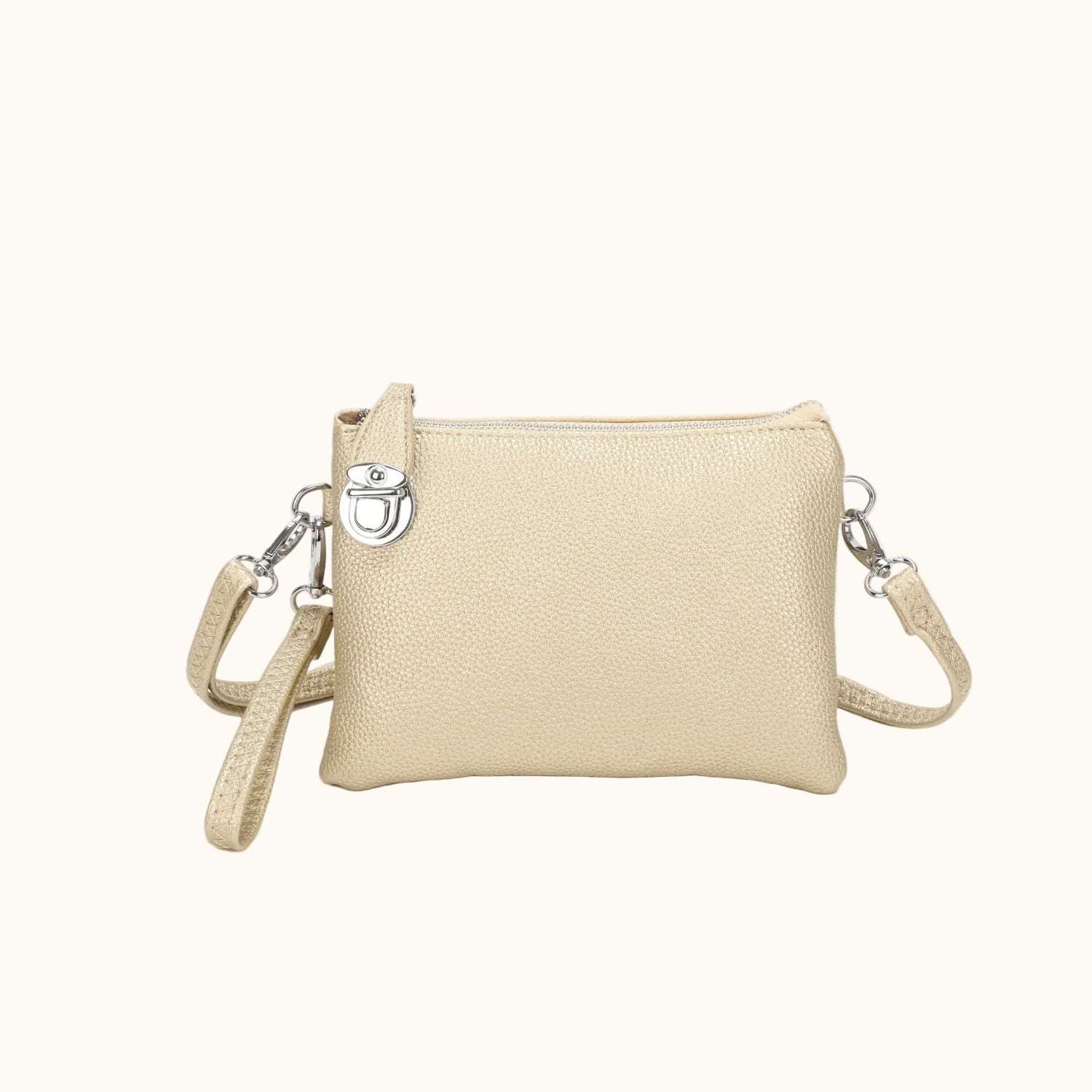 Beige crossbody bag with a strap on a white background