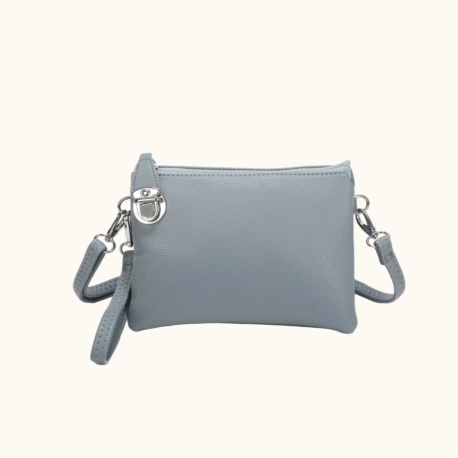 Gray crossbody bag with a strap on a white background