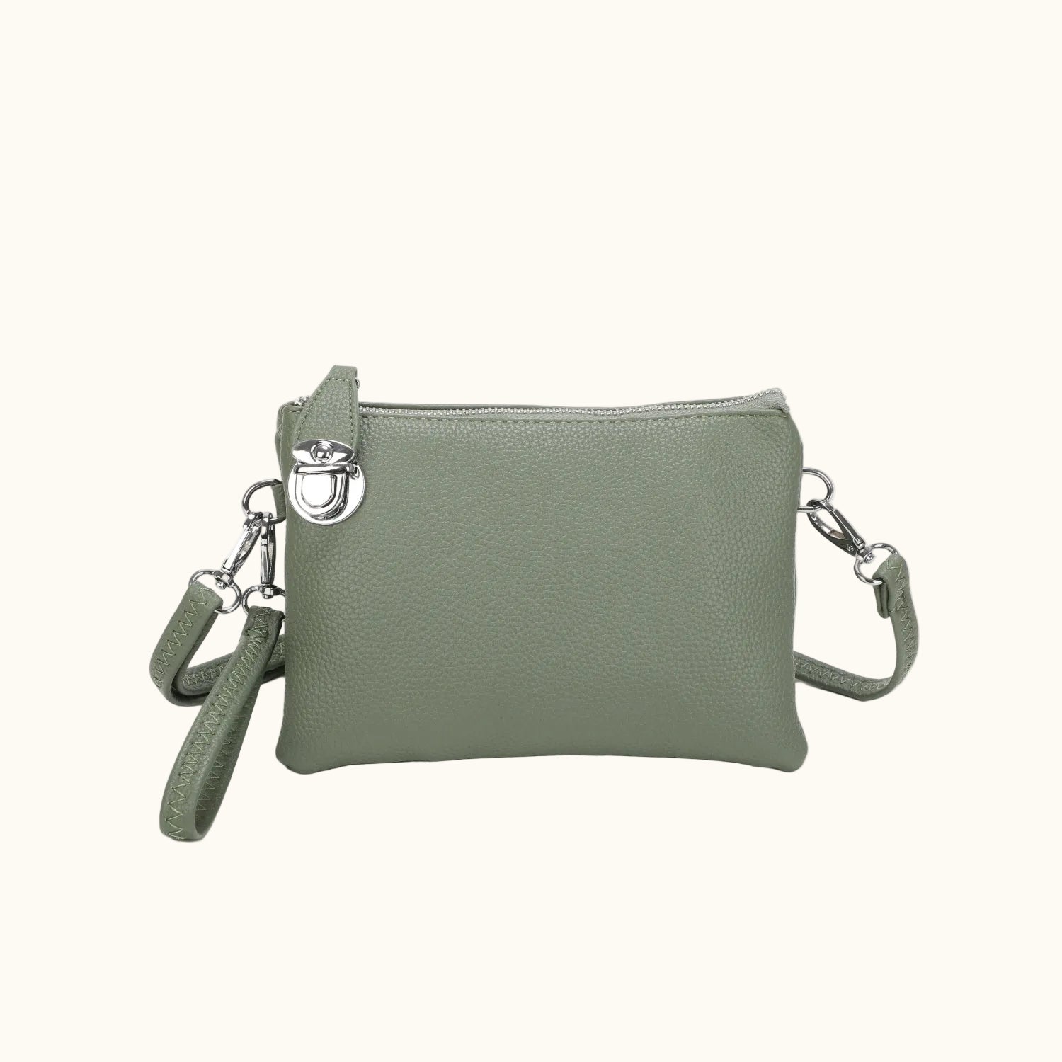 Green crossbody bag with a strap on a white background