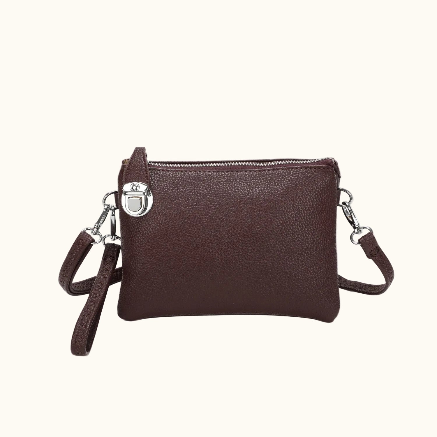 Brown leather crossbody bag on a white background