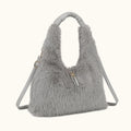 Gray fluffy handbag with a strap on a white background