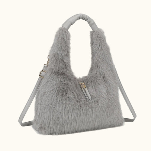 Gray fluffy handbag with a strap on a white background