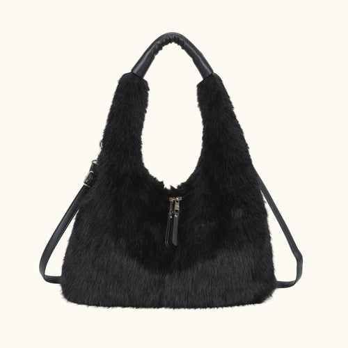 Black fur handbag with a visible zipper on a white background