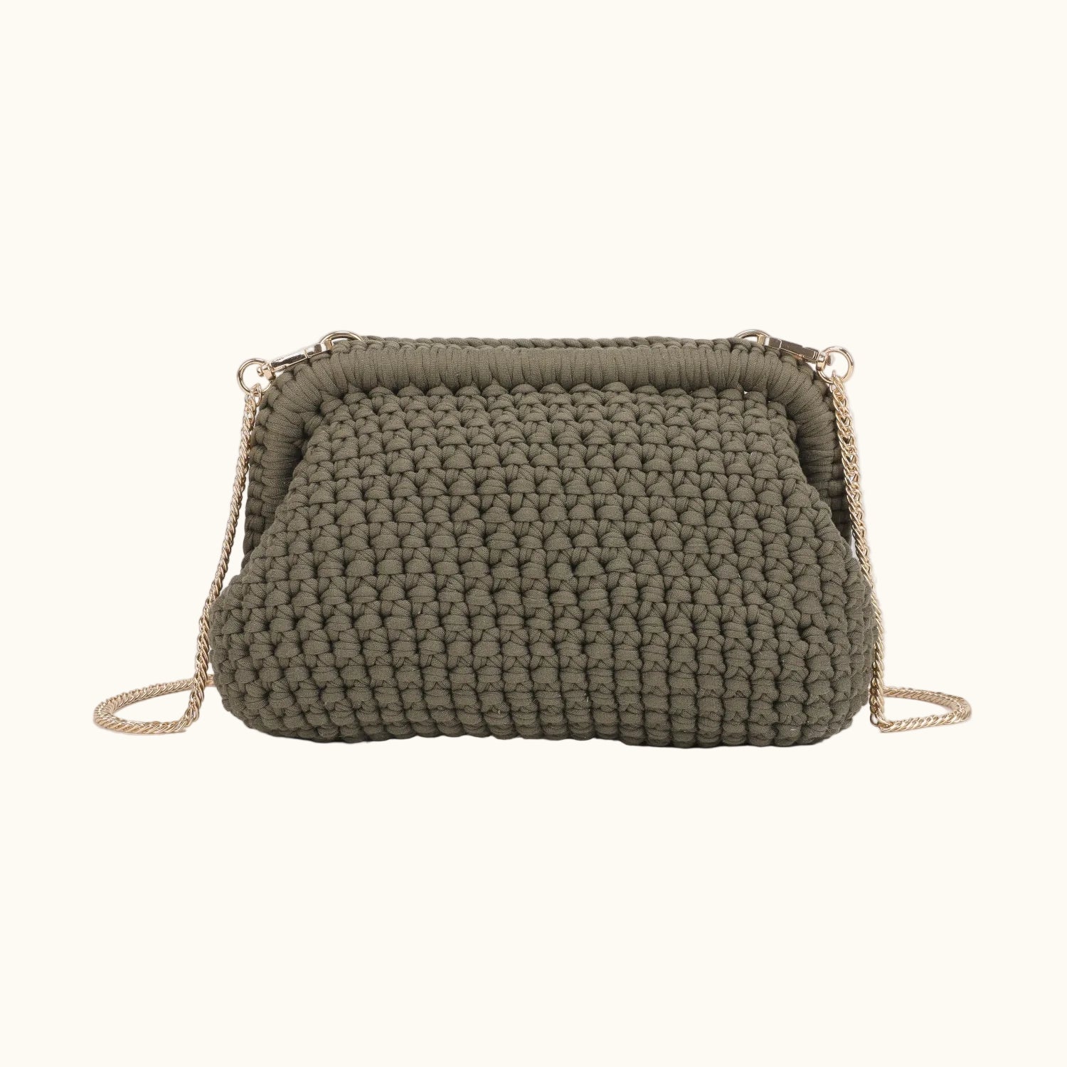 Green crochet handbag with a chain strap on a white background