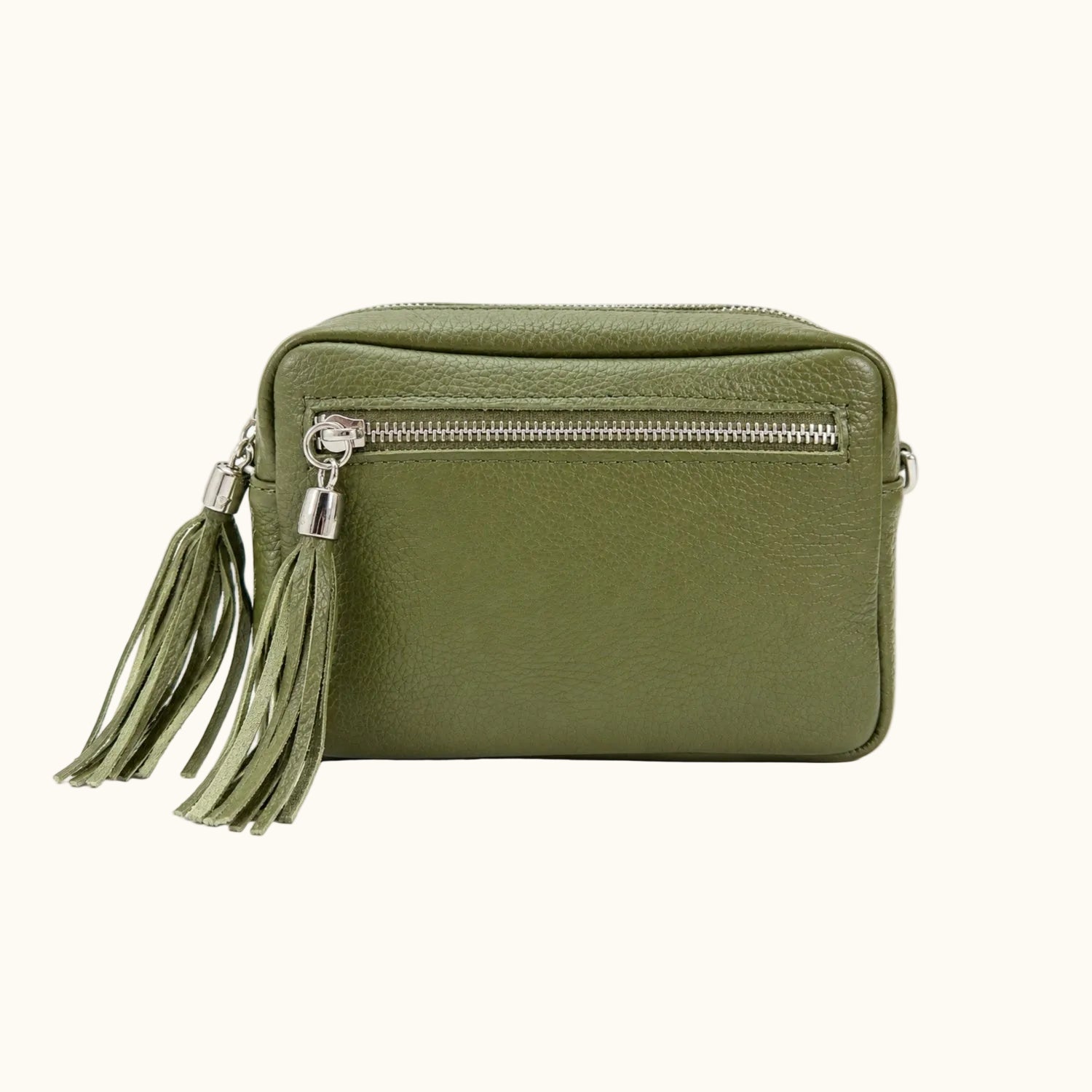 Green handbag with a tassel on a white background