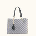 Gray handbag with black tassel and pattern on a white background