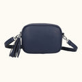 Navy blue crossbody bag with tassel on a white background