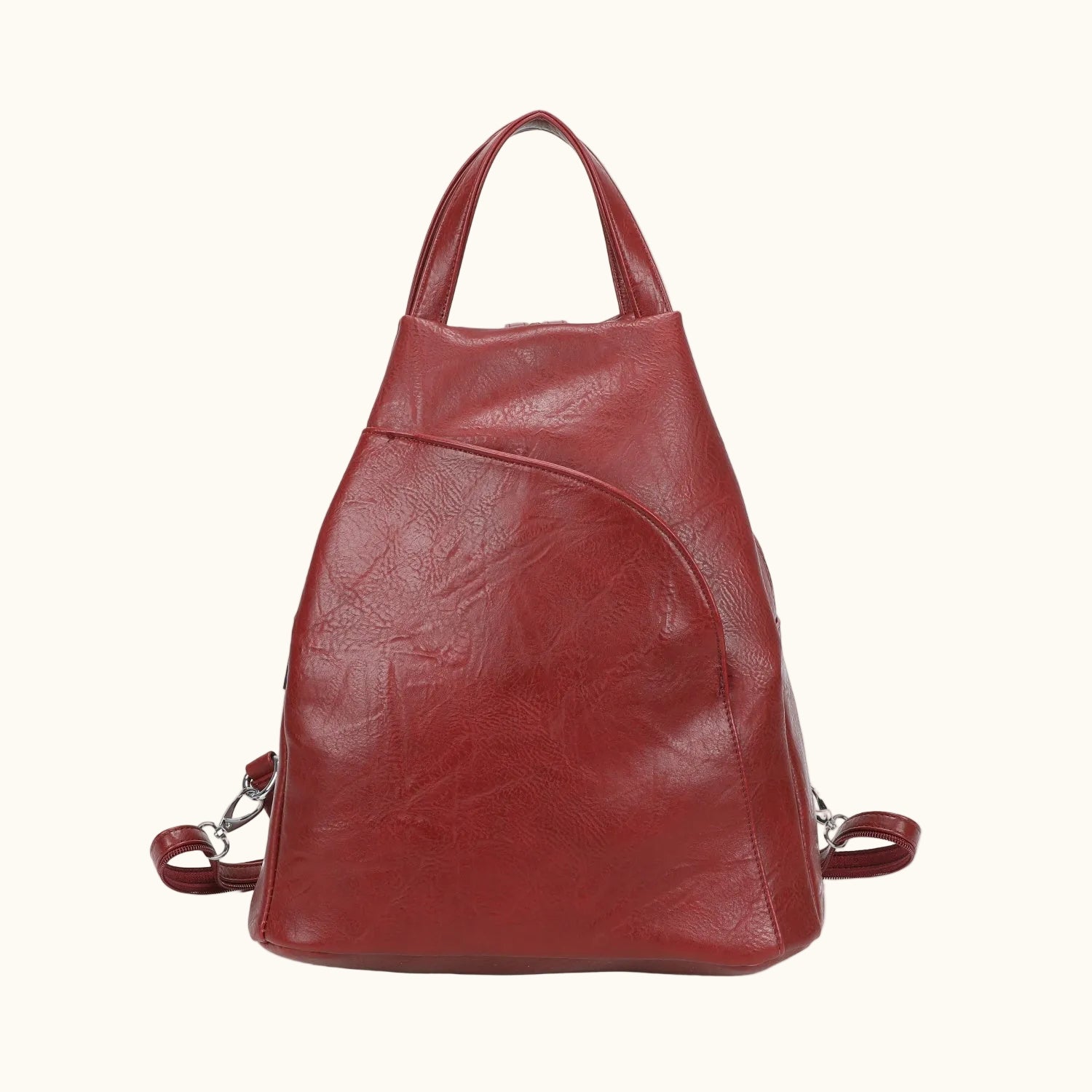 Red leather backpack on a white background