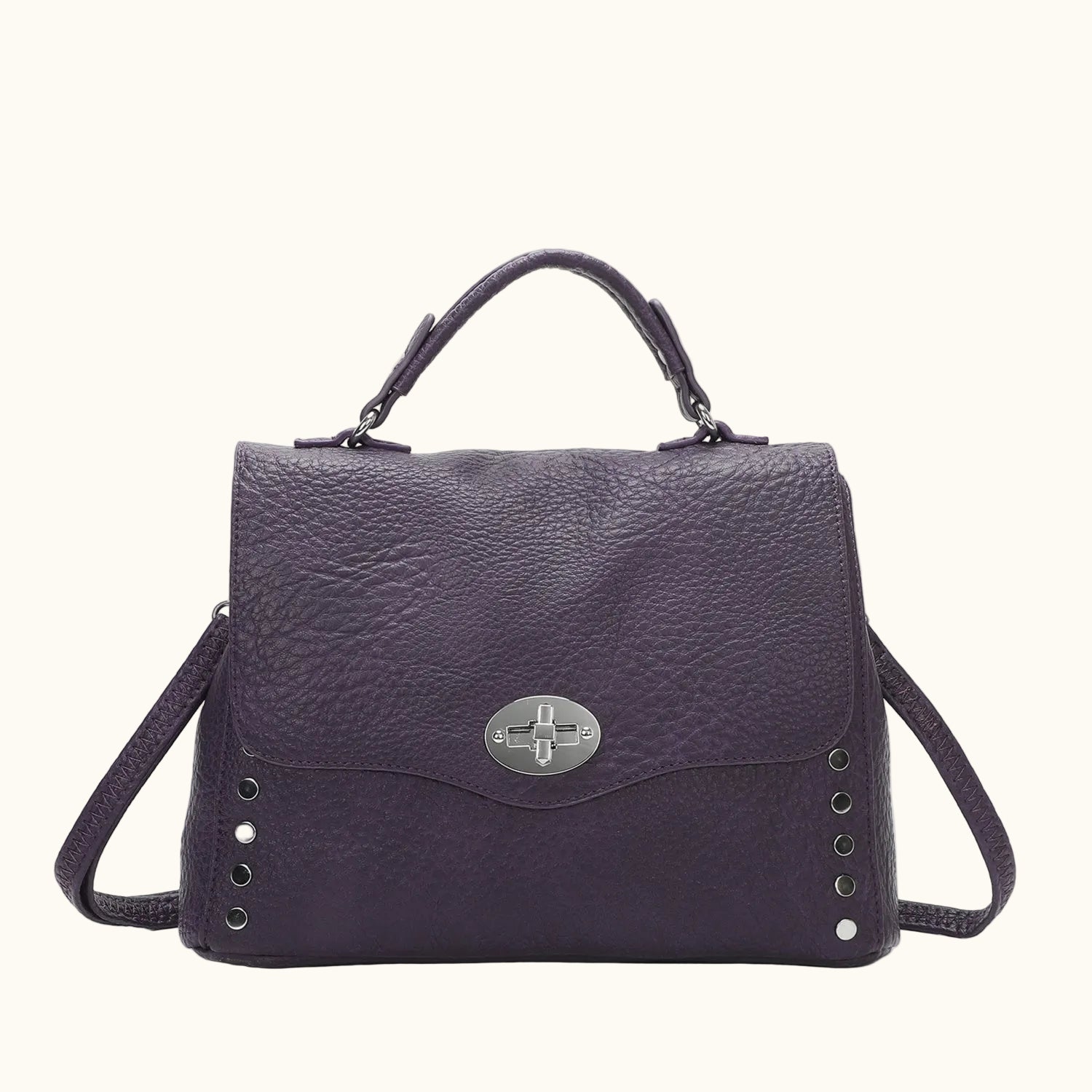 Purple handbag with a silver clasp on a white background