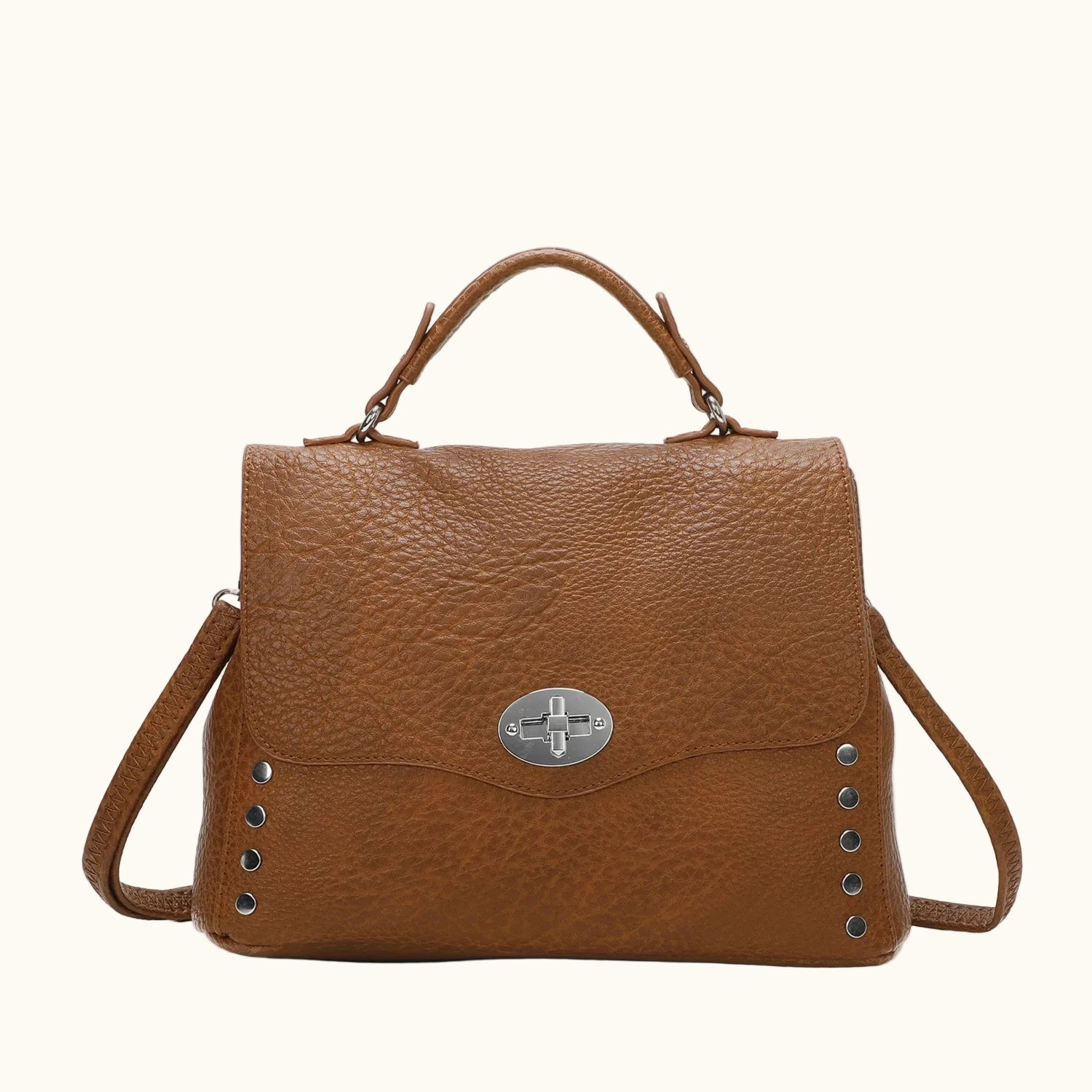 Brown leather handbag with silver clasp on a white background