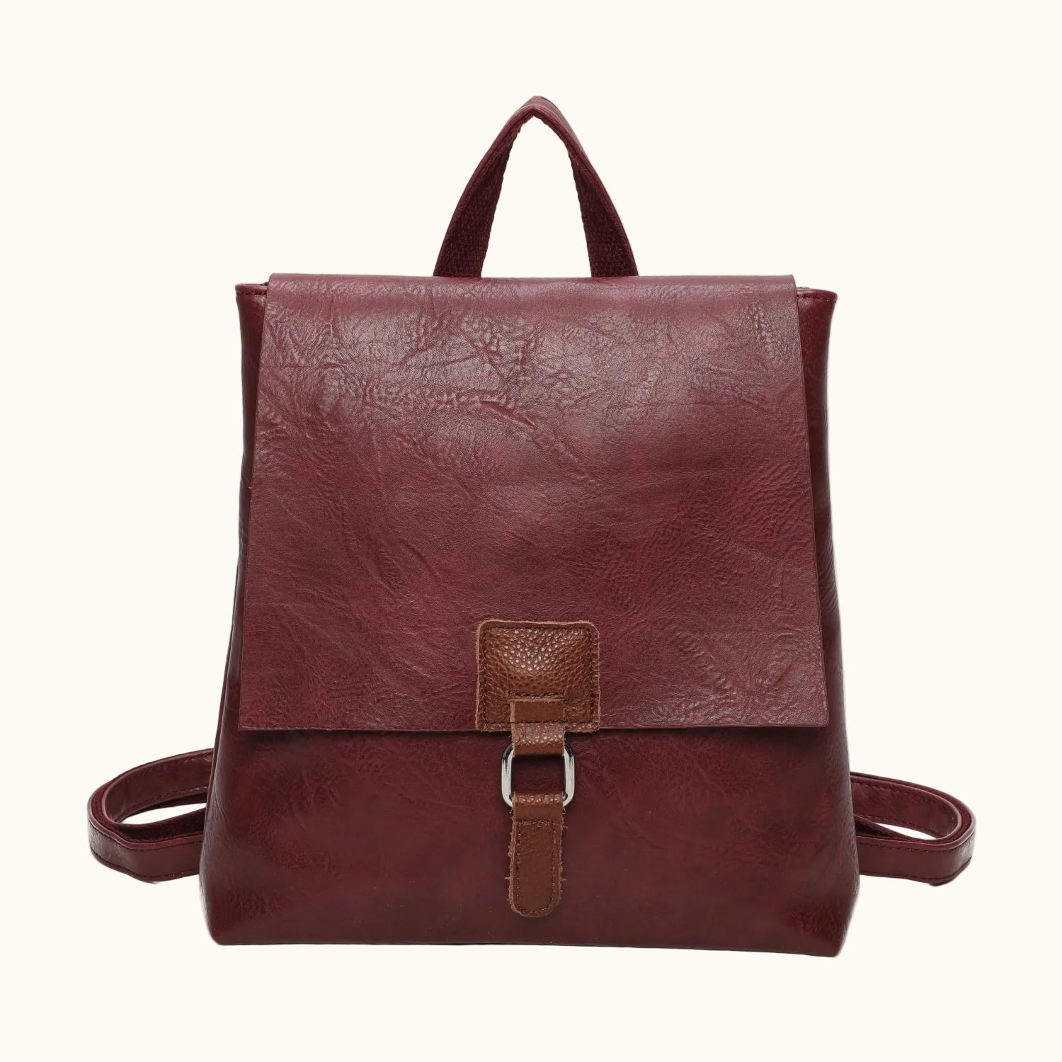 Brown leather backpack on a white background