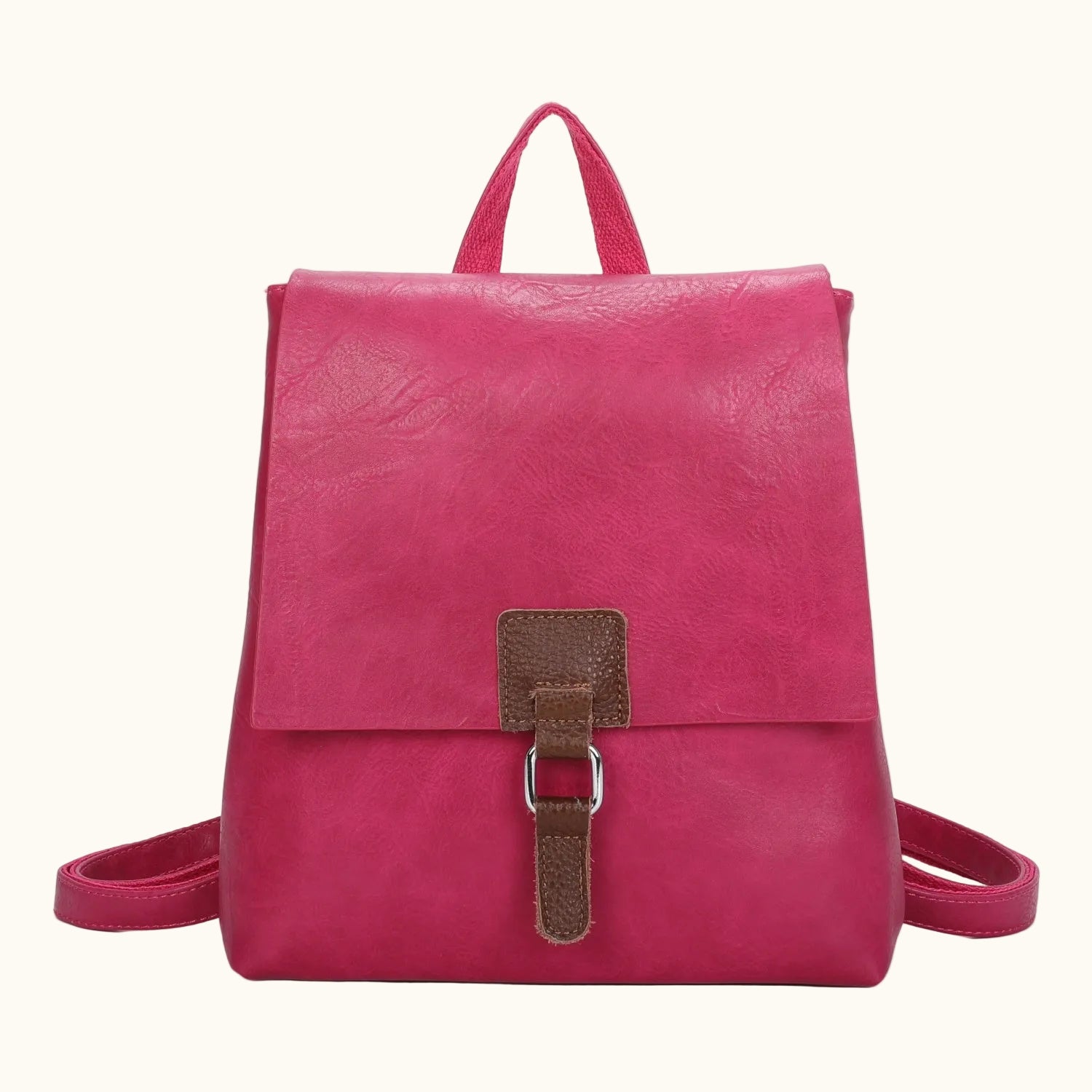 Pink backpack with a brown buckle on a white background