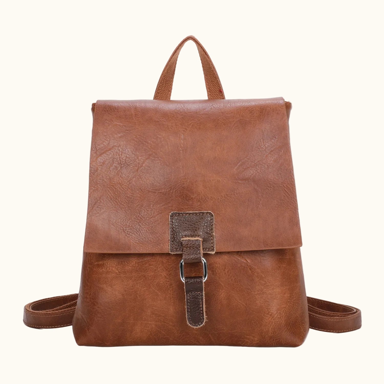 Brown leather backpack on a white background
