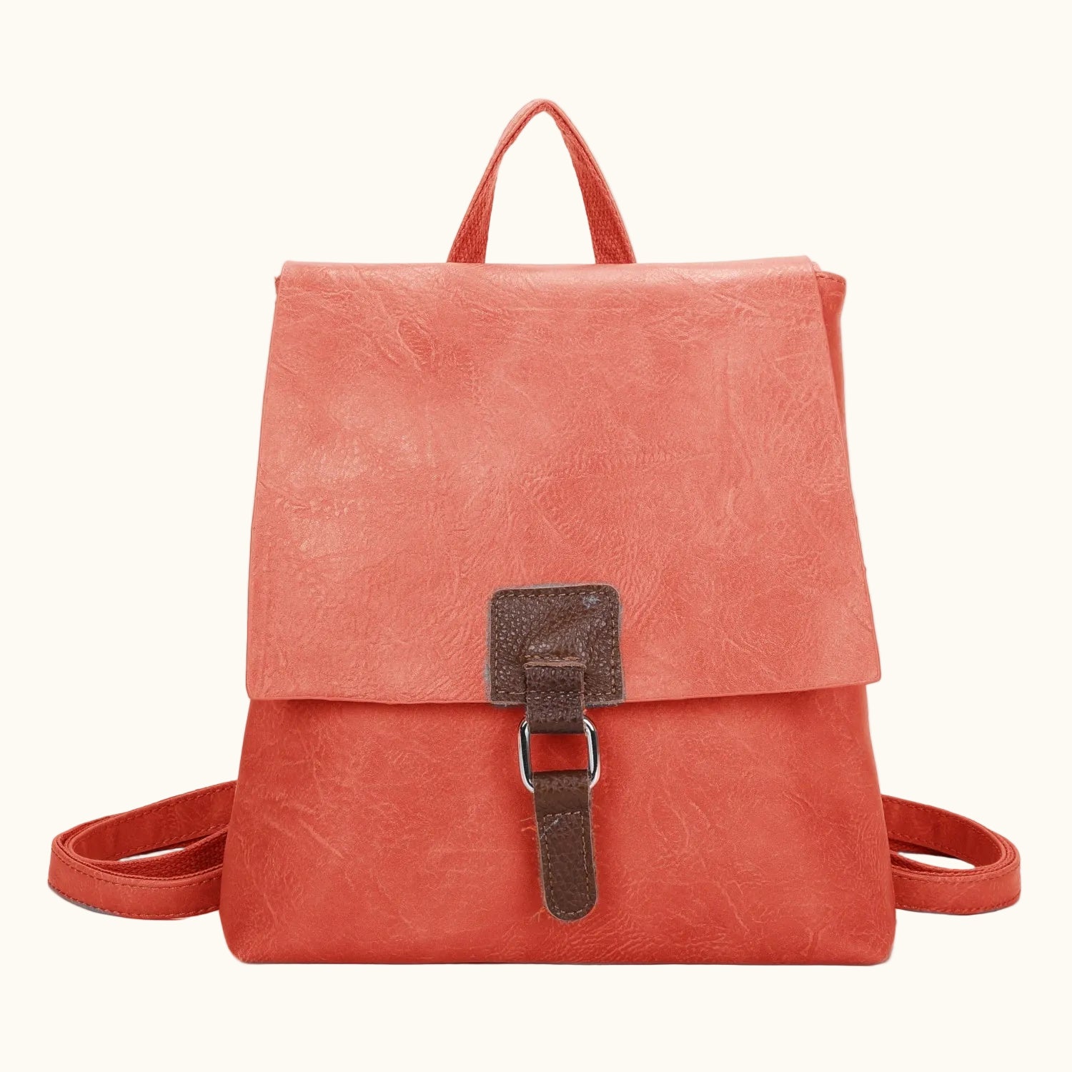 Coral backpack with a buckle on a white background