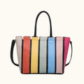 Colorful striped handbag with a black handle and strap on a white background