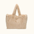 Beige fluffy bag with handles on a white background