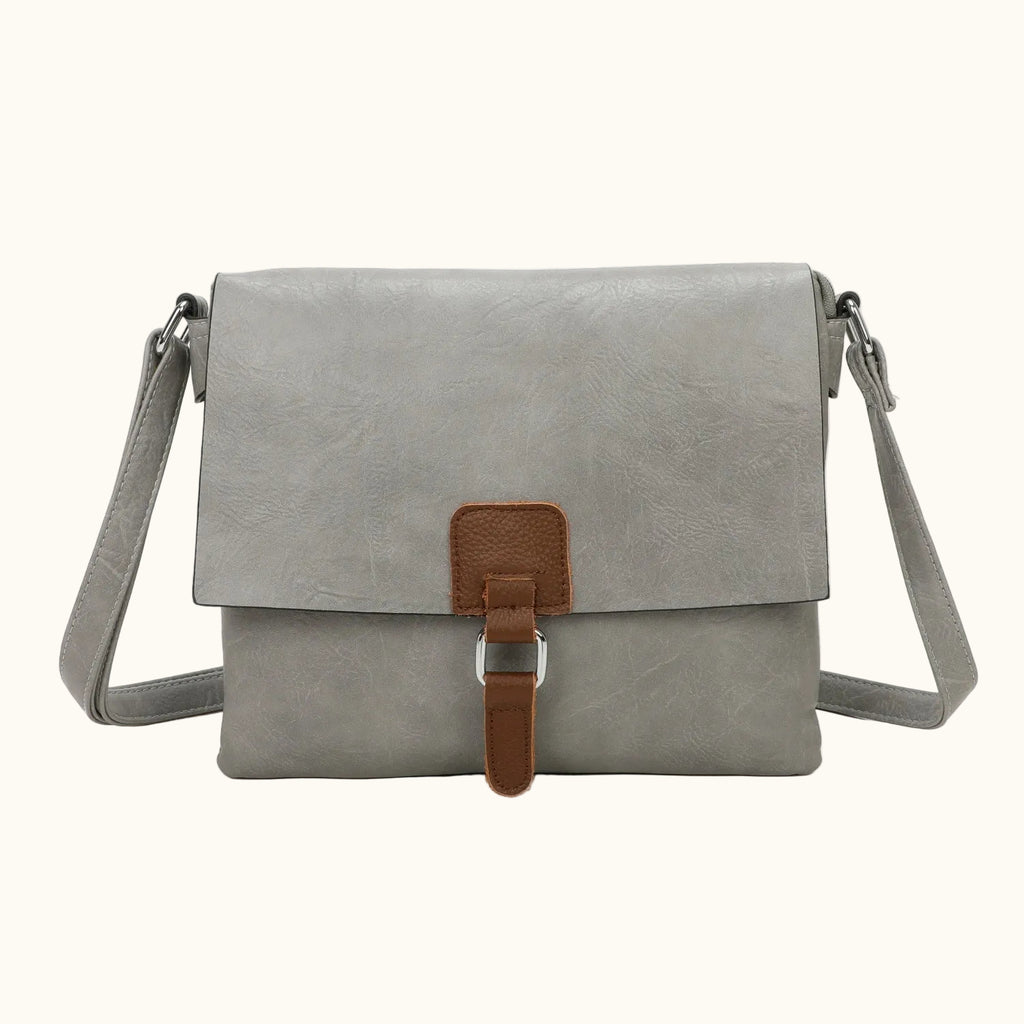 Gray shoulder bag with brown strap on a white background