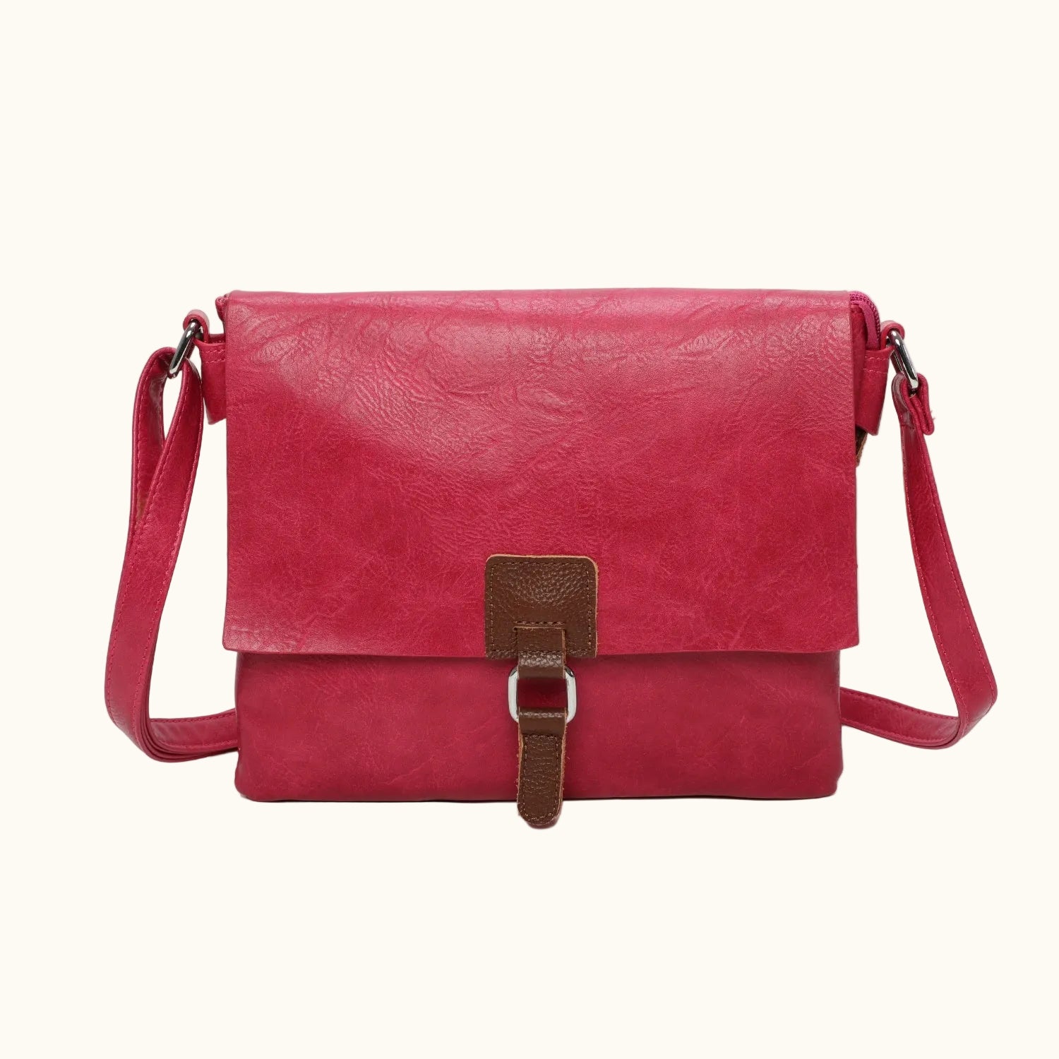 Red leather handbag with a brown strap on a white background