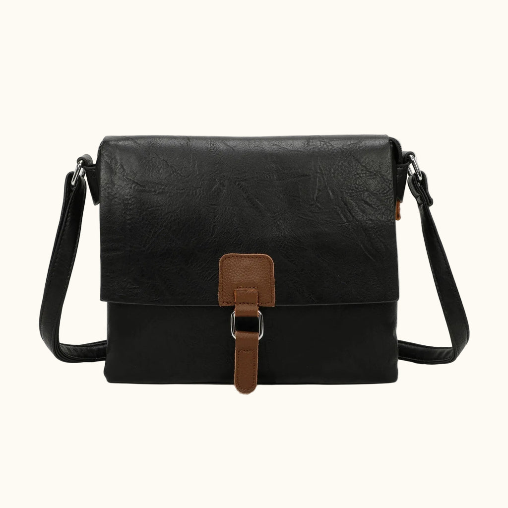 Black leather crossbody bag with brown accents on a white background