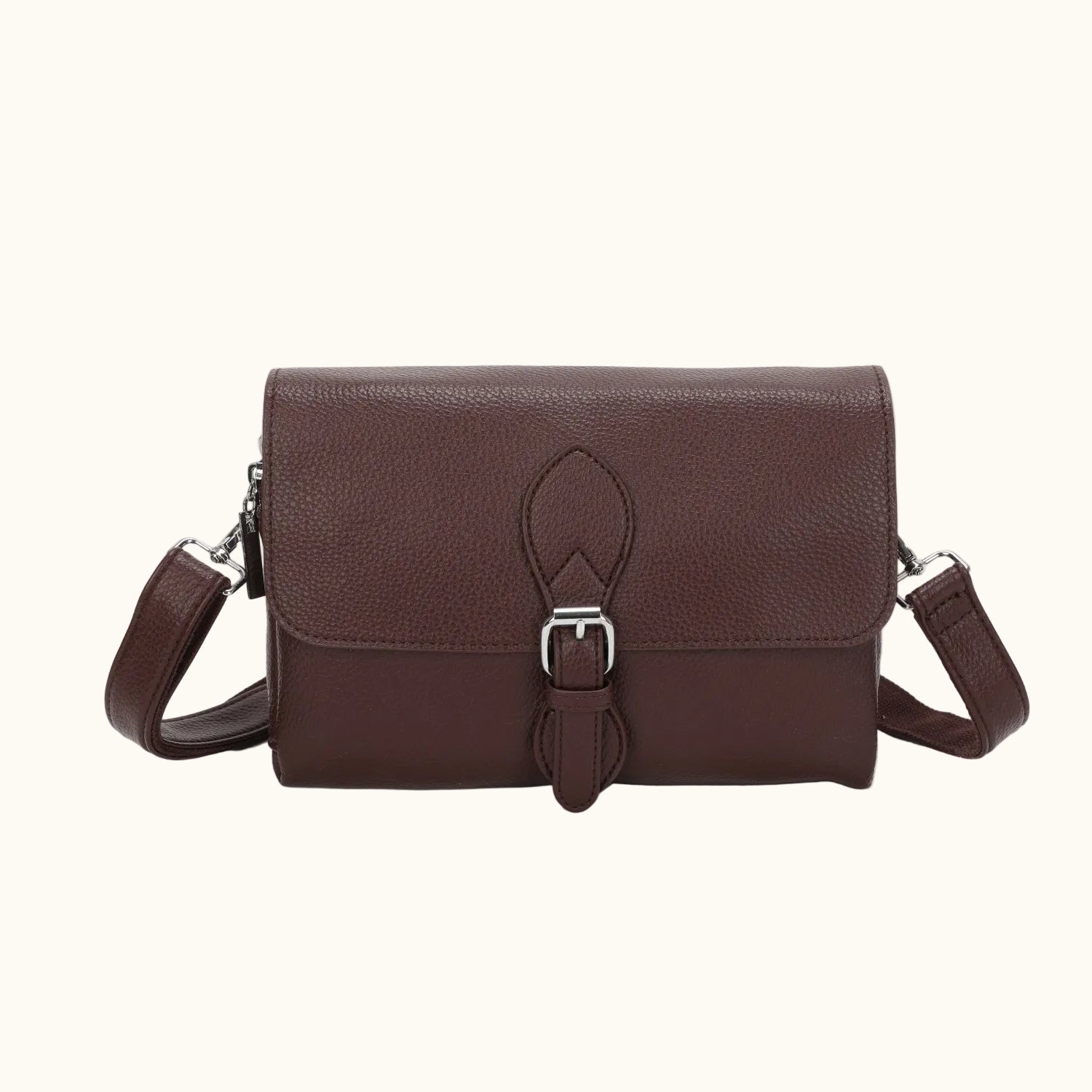 Brown leather bag with a buckle on a white background
