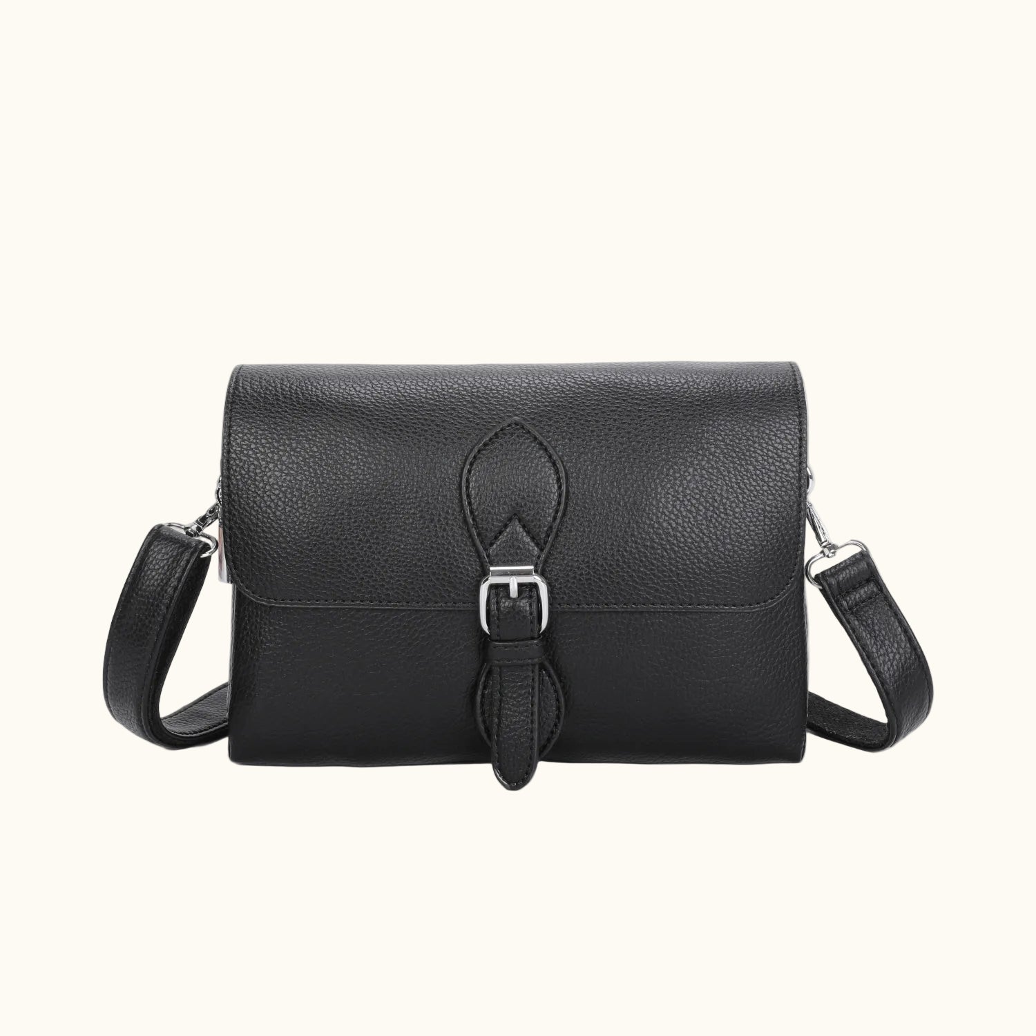 Black leather handbag with a strap on a white background