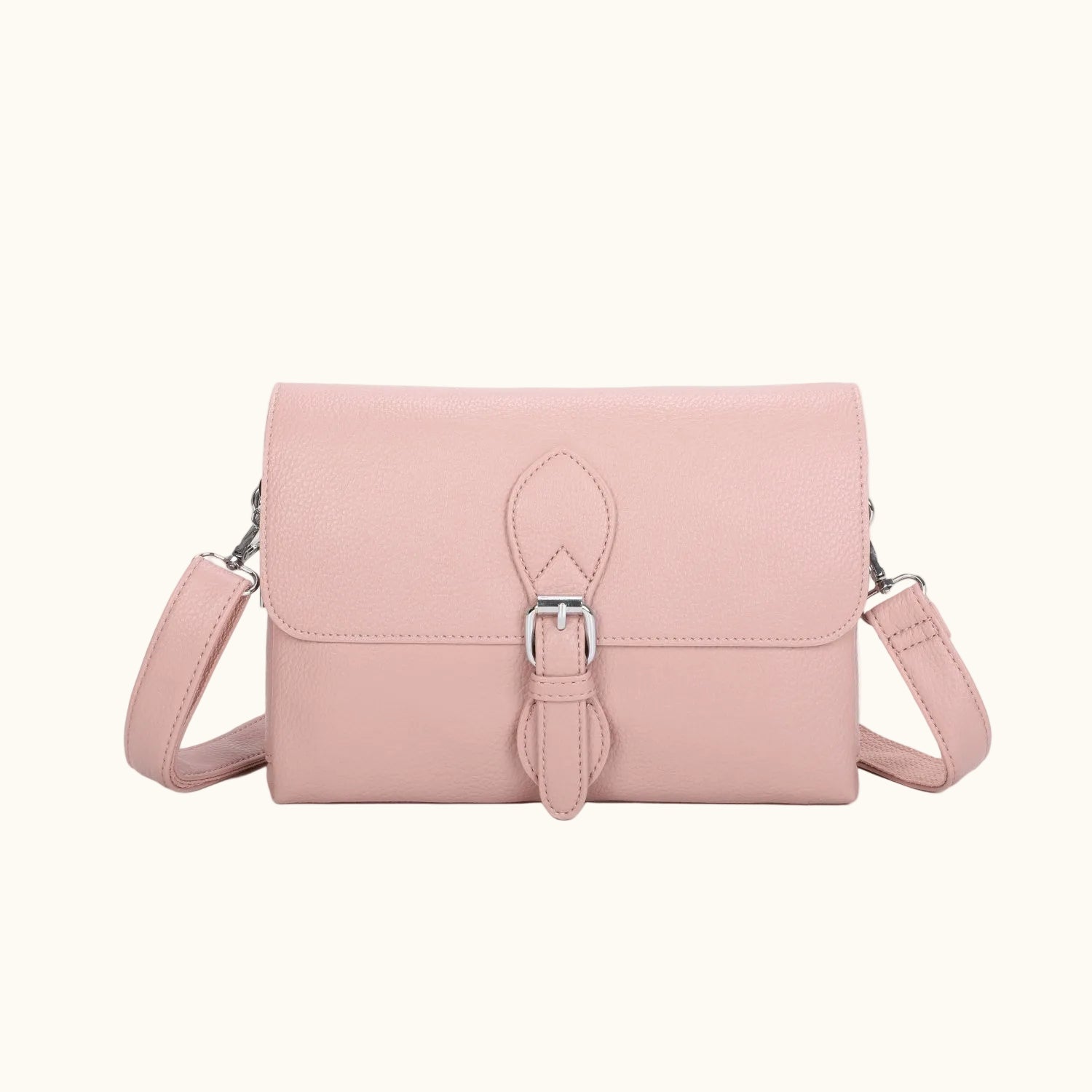 Pink handbag with a strap on a white background
