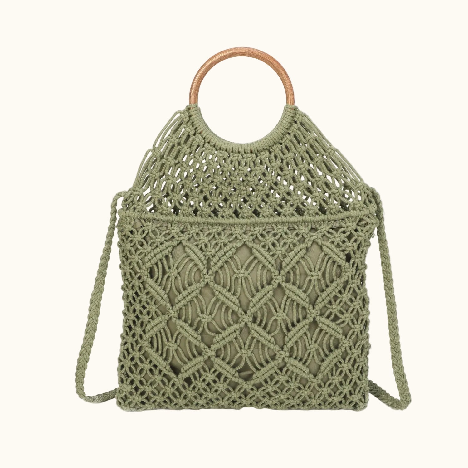 Green woven handbag with wooden handle on a white background