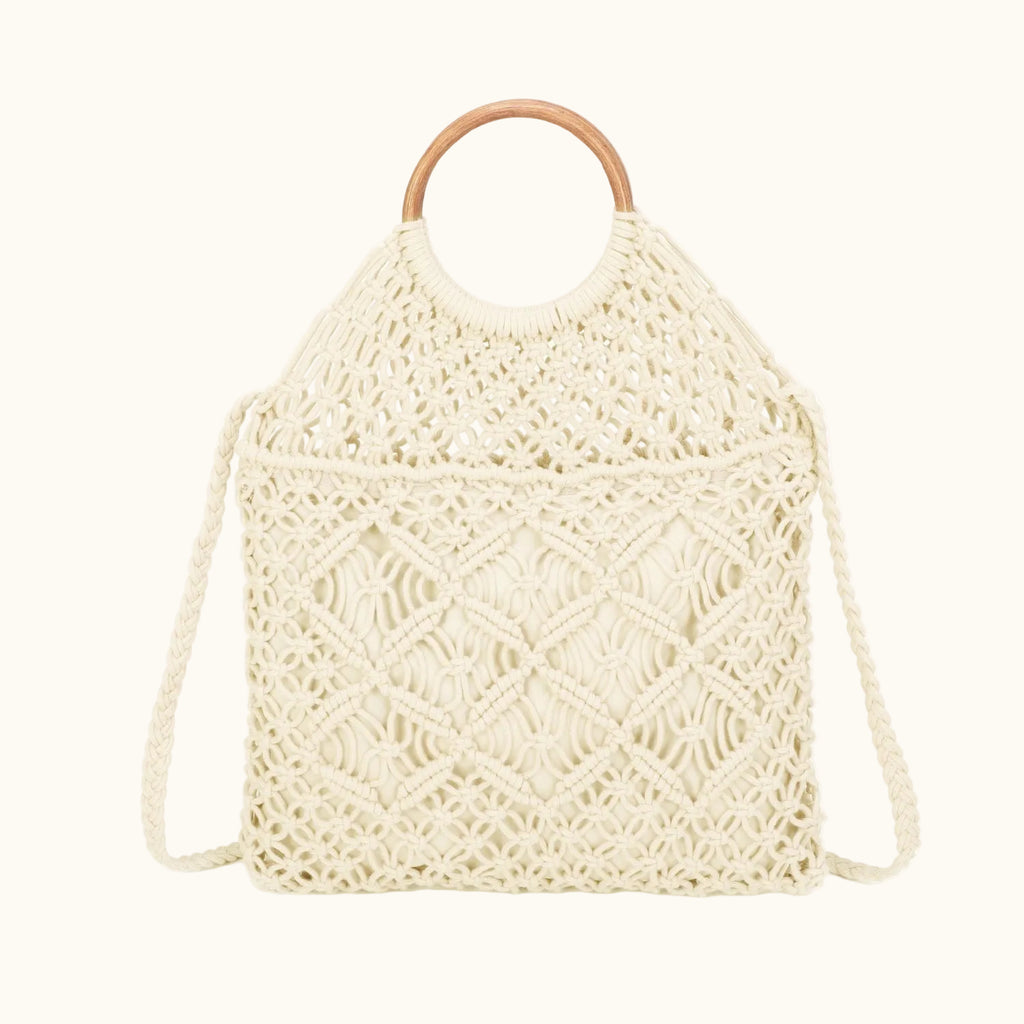 Beige woven handbag with wooden handle on a white background