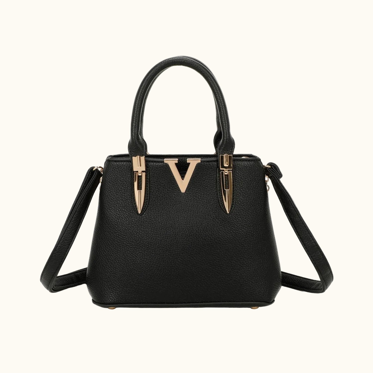 Black handbag with gold accents on a white background