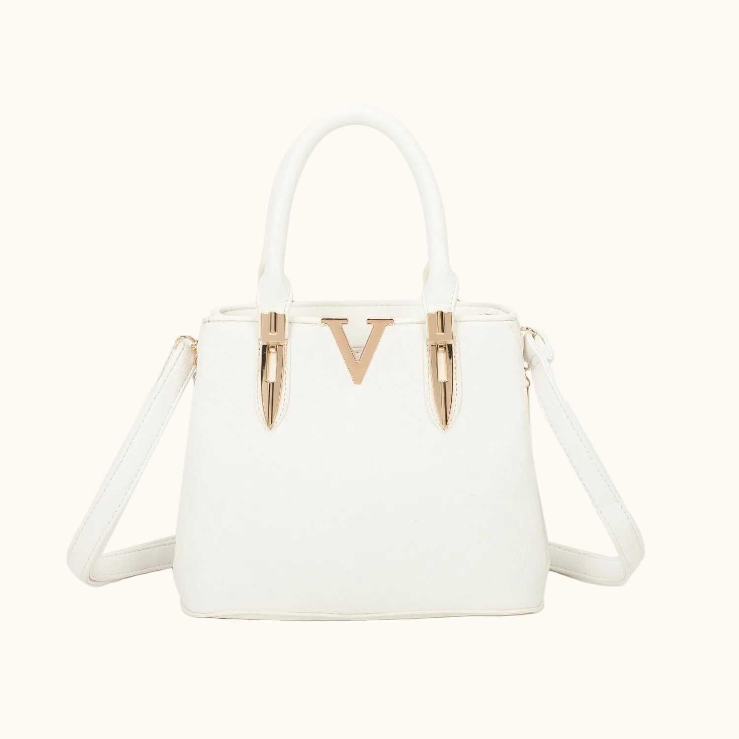 White handbag with gold accents on a white background