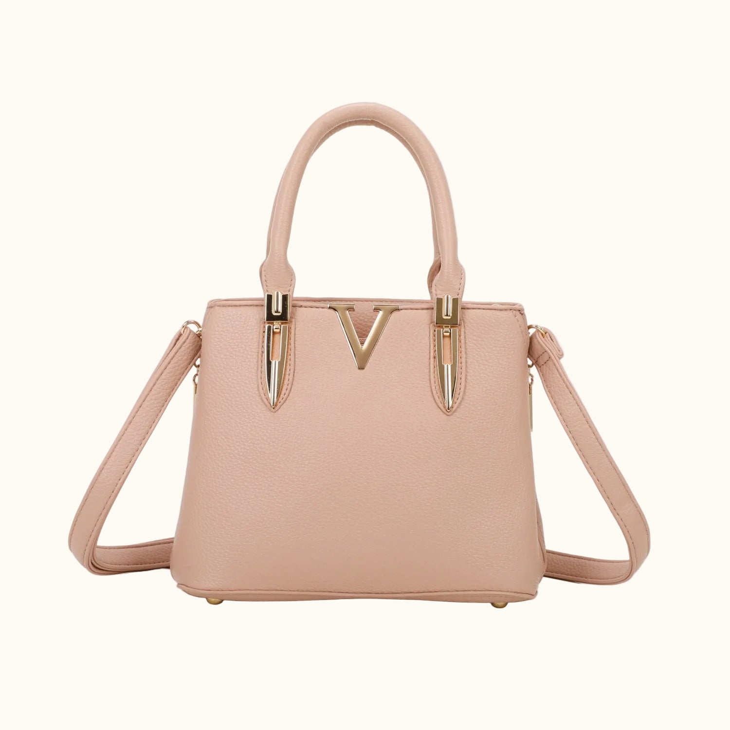 Pink handbag with gold accents on a white background