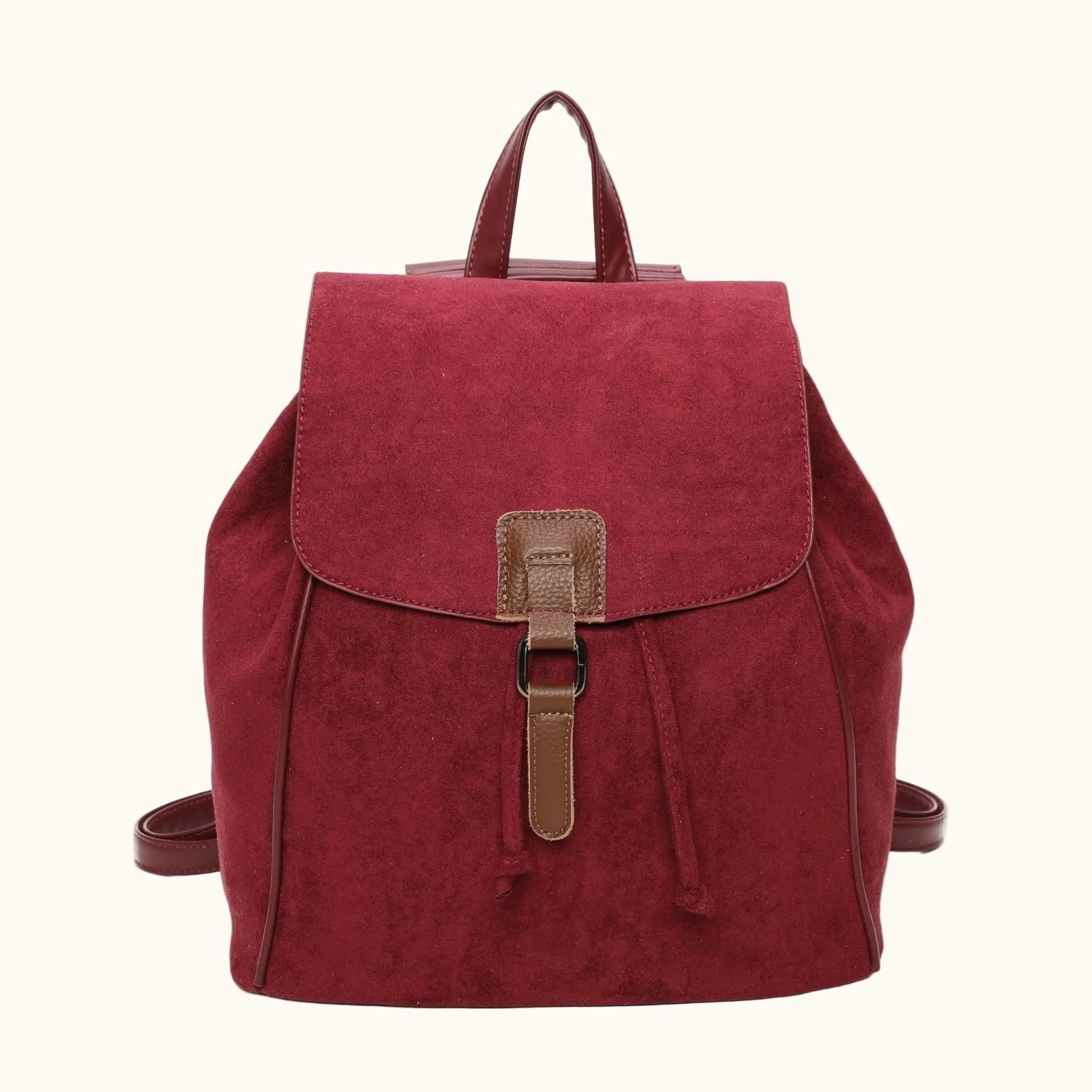 Red backpack with a brown buckle on a white background