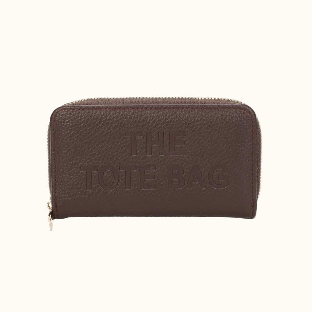 Brown leather wallet with 'THE TOTE BAG' embossed on a white background