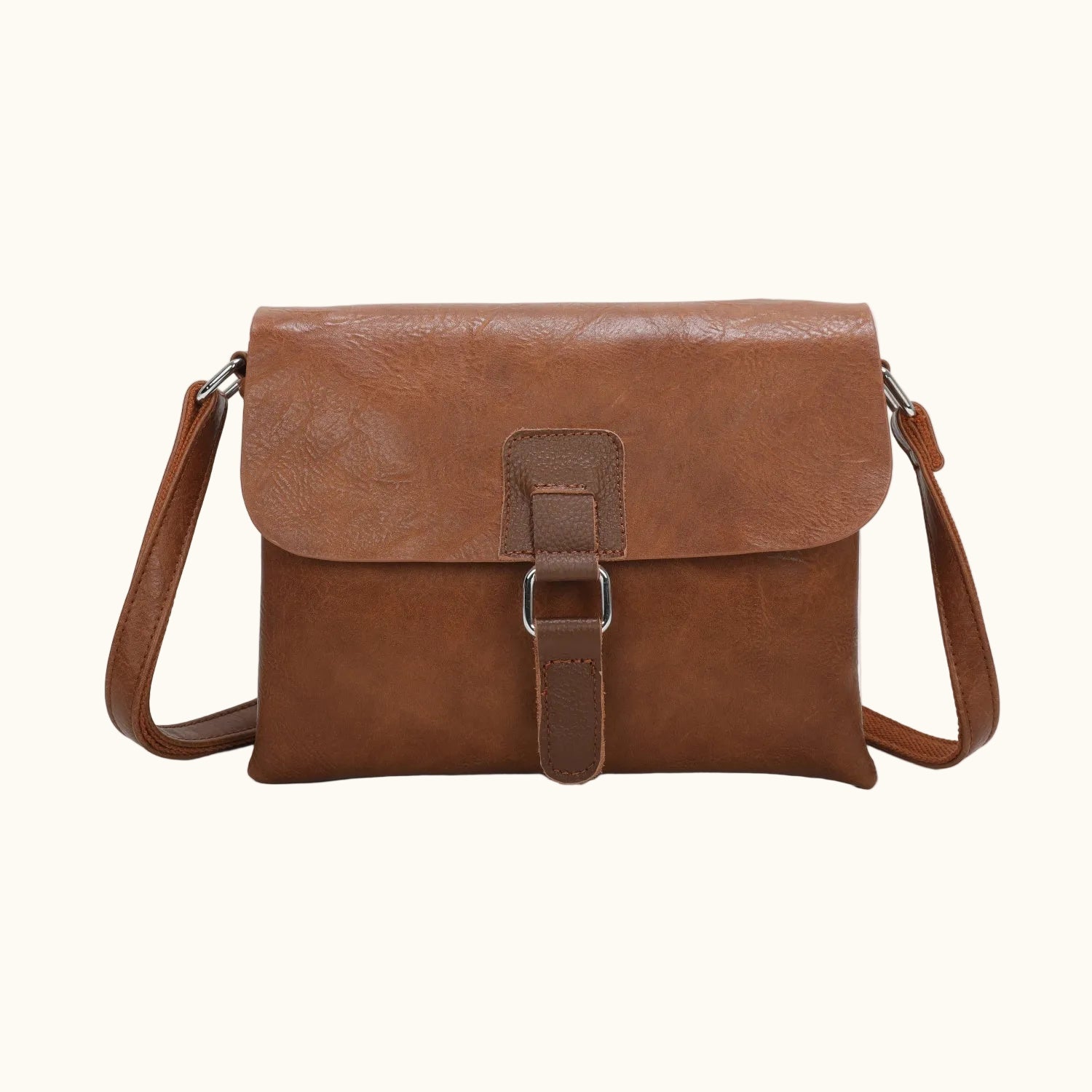 Brown leather crossbody bag on a white background